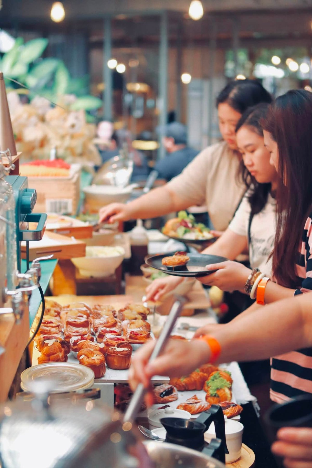 Guests selecting freshly baked food at the buffet